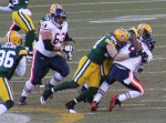 A few Packers bring Jay Cutler to the ground.