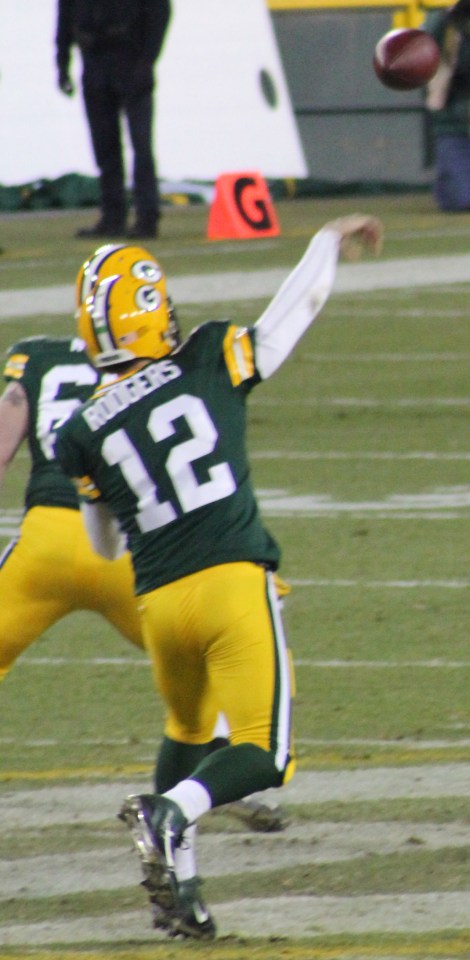 Aaron Rodgers sails a ball down the field at Lambeau against the Oakland Raiders.